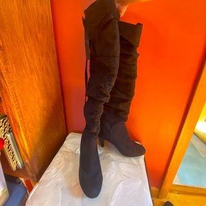 Black heeled knee high boots